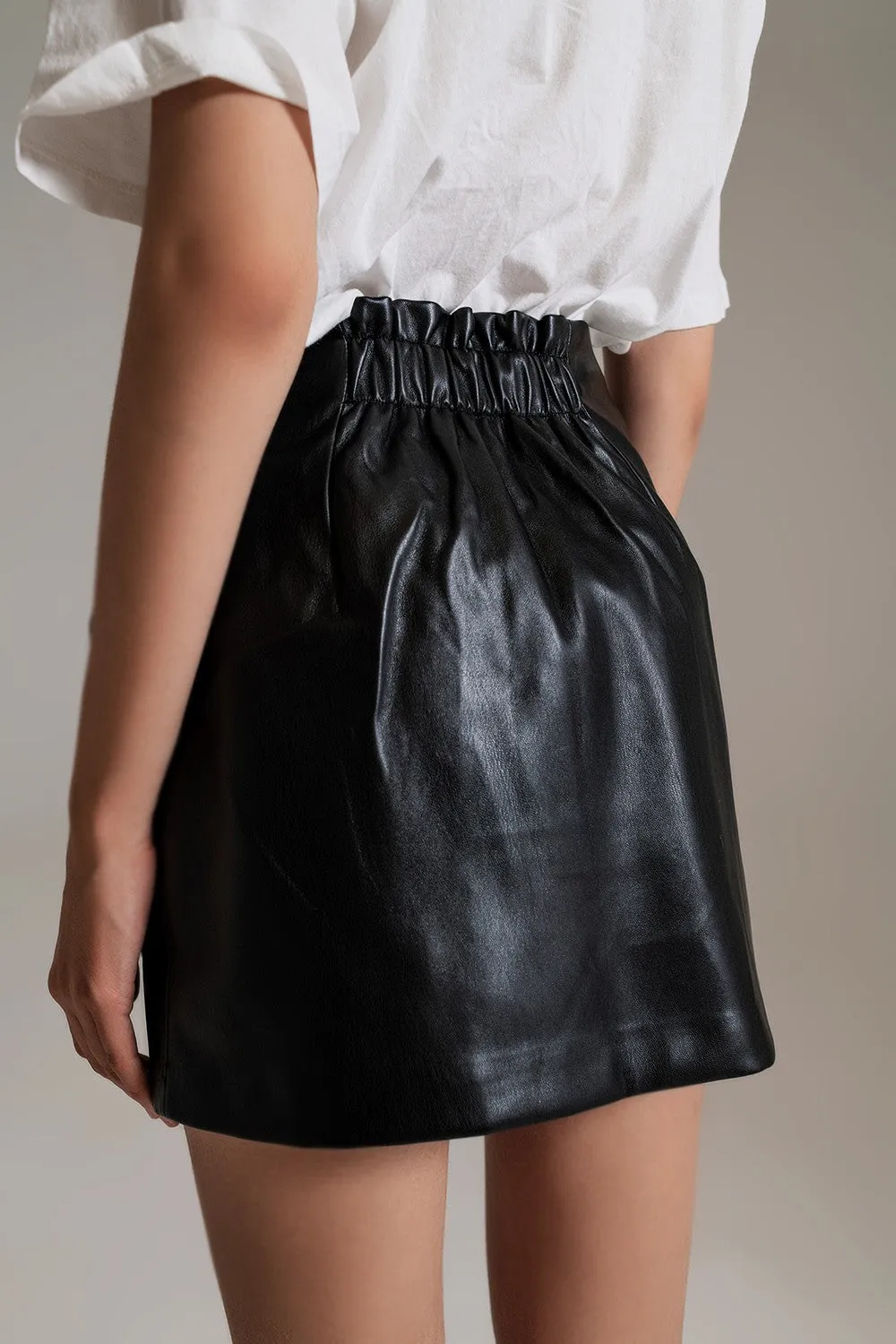 BLACK FAUX LEATHER MINI SKIRT WITH BOW
